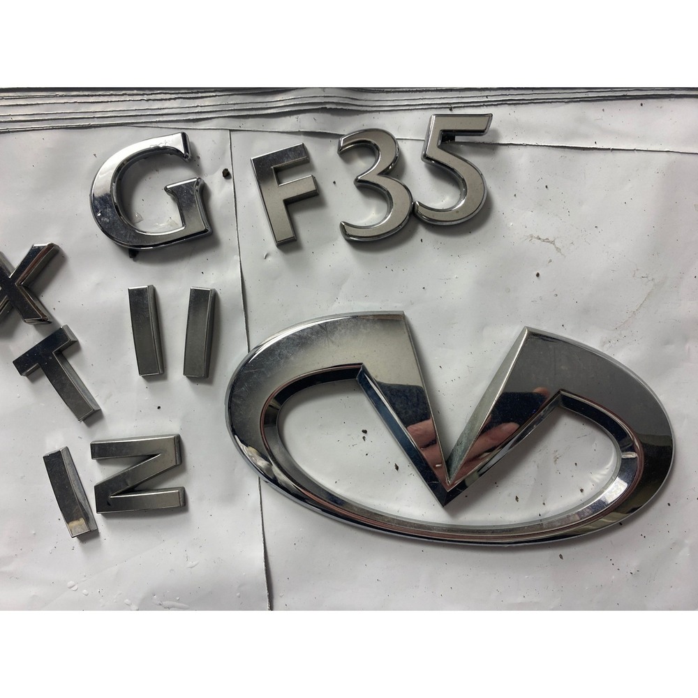 OEM Infiniti Front Grille Emblem Badge Chrome Logo Genuine Factory